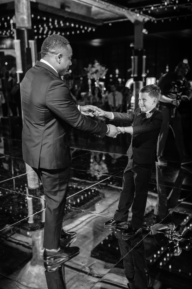 The groom and his stepson dancing at the wedding reception.