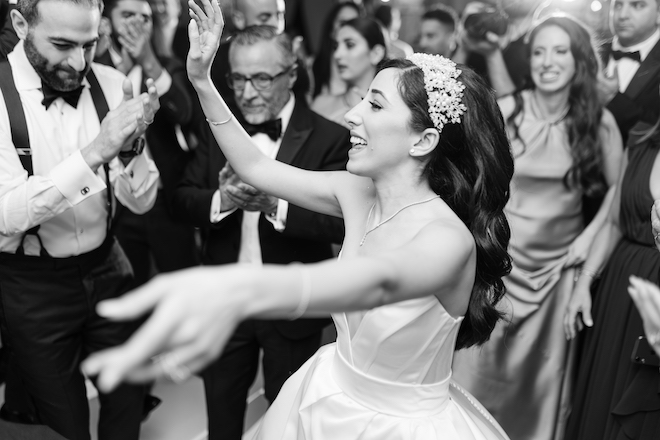 The bride dancing at the wedding reception.