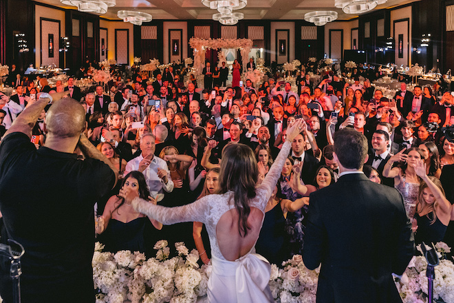 The couple and a Houston rapper singing on stage.