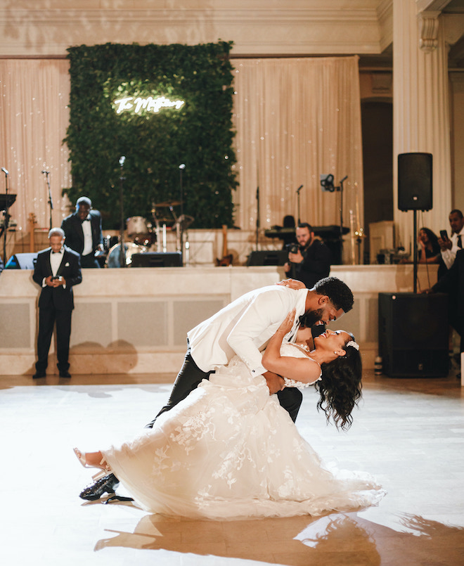 The groom dipping the bride during their first dance.