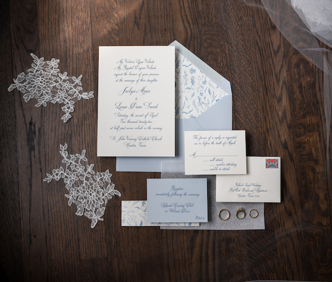 Light blue and white invitation suite.