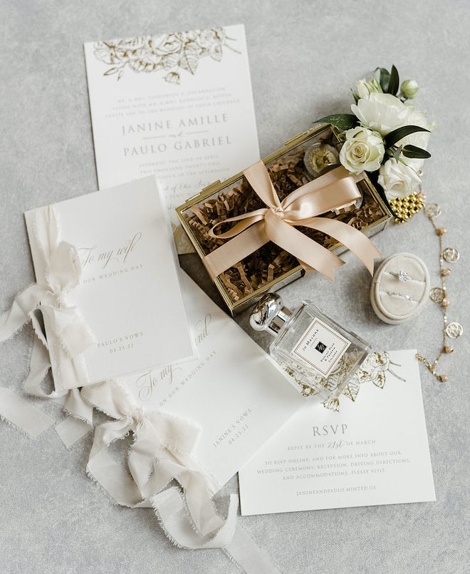 A timeless champagne colored wedding invitation suite.