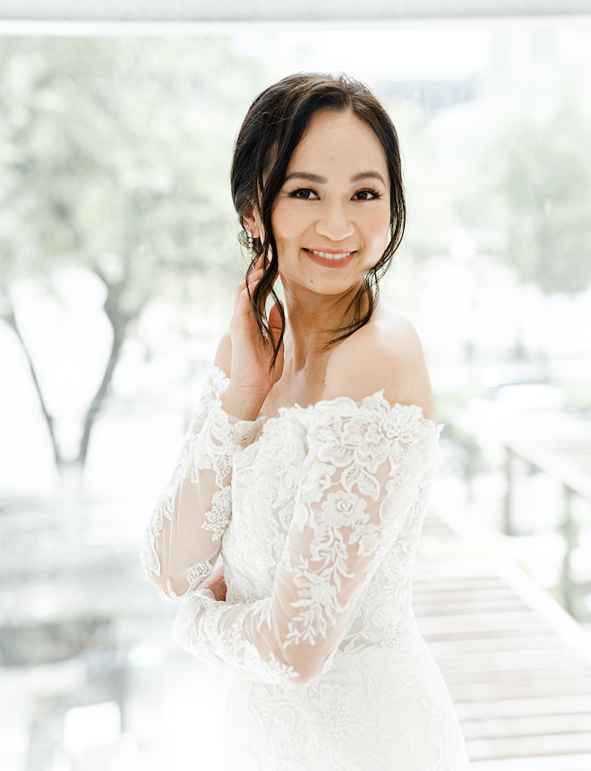 The bride smiling before her wedding ceremony.