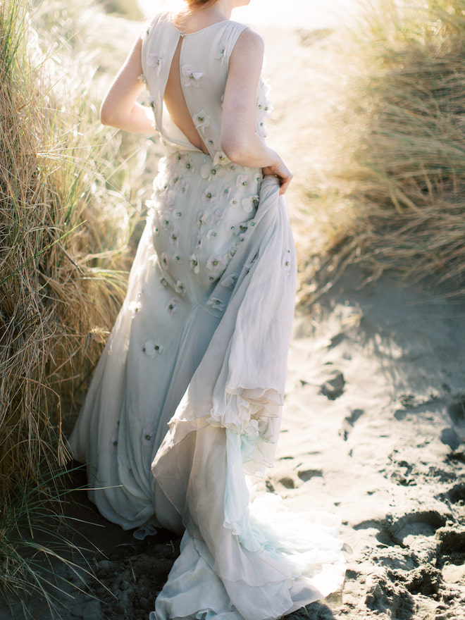 The back of the brides Dennis Basso seafoam gown with floral appliques.