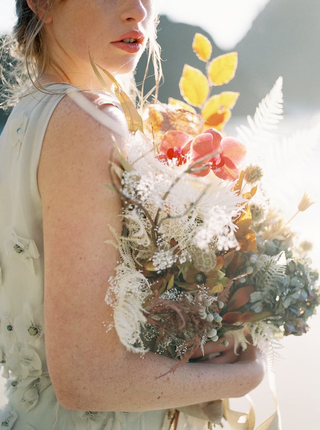 The bride holding a bouquet.