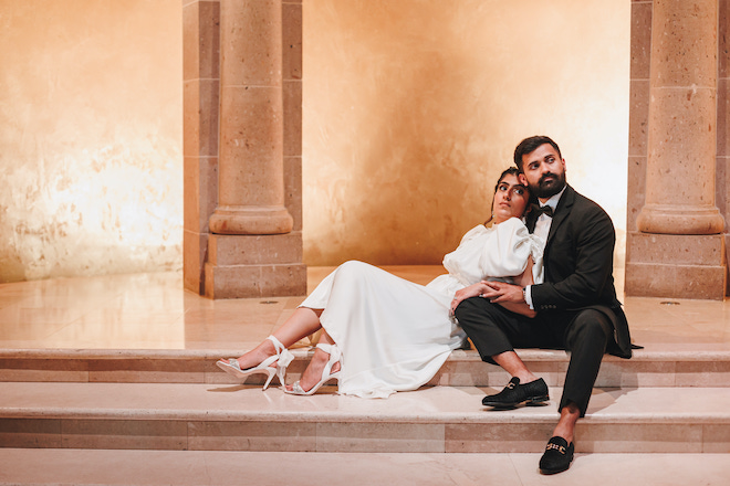 The bride leaning on the groom for their engagements at The Bell Tower on 34th.