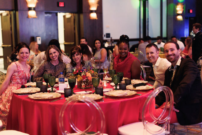 Six people sitting at a round table at the dinner portion of the NACE trends event.