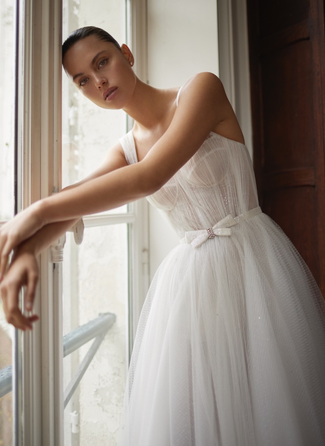 A tulle gown with a corset top by Dana Harel.