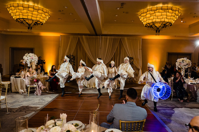 A traditional Palestinian dance being performed on the dance floor. 