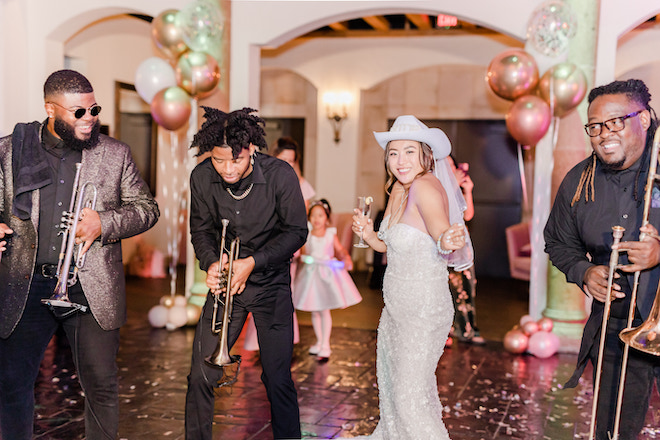 The bride dancing with three members of Danny Ray and the Atlantic Street Band.