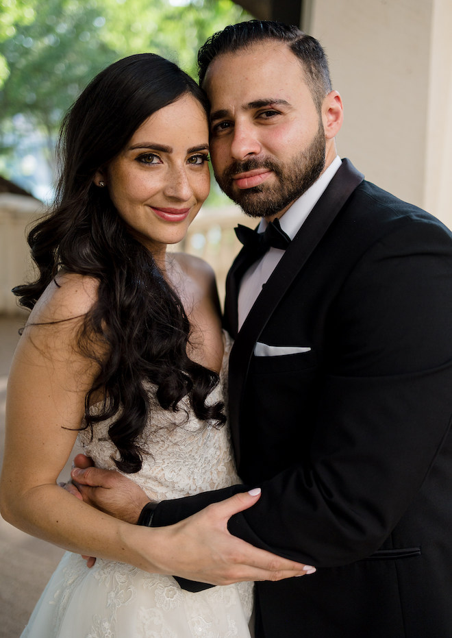 The bride and groom smiling. 