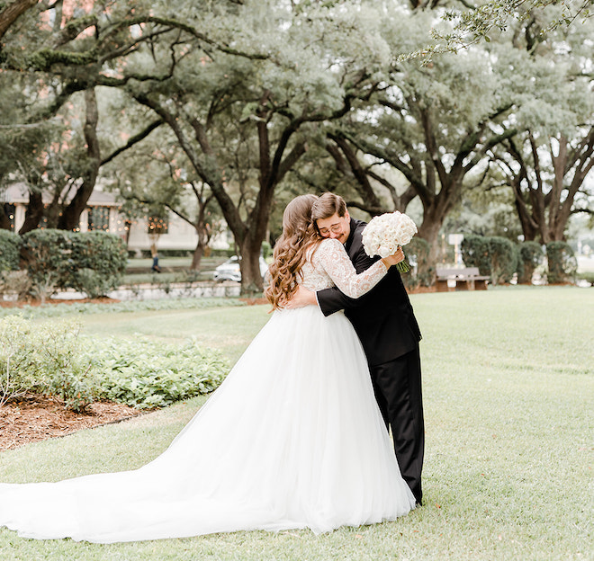 The bride and groom hugging during their first look. 