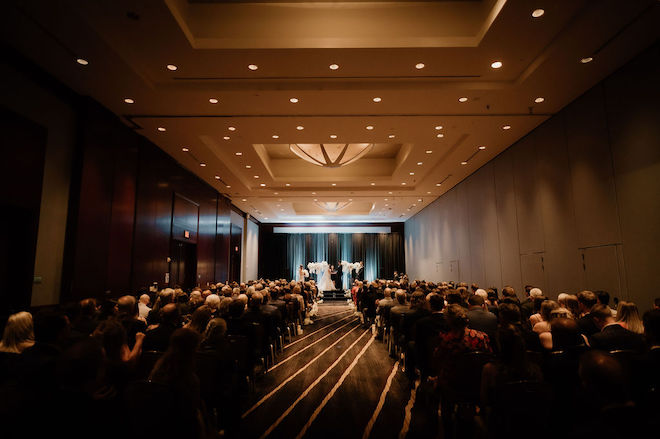 A ballroom wedding ceremony at The Royal Sonesta Houston Galleria.