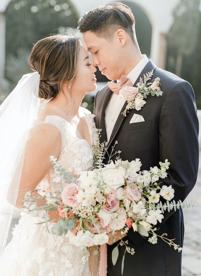 The bride and groom look into each others eyes at their outdoor ceremony at the Bell Tower on 34th.