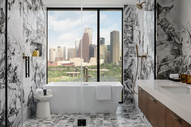 The bathrooms at the wedding venue, Thompson Houston has skyline views of Houston. 