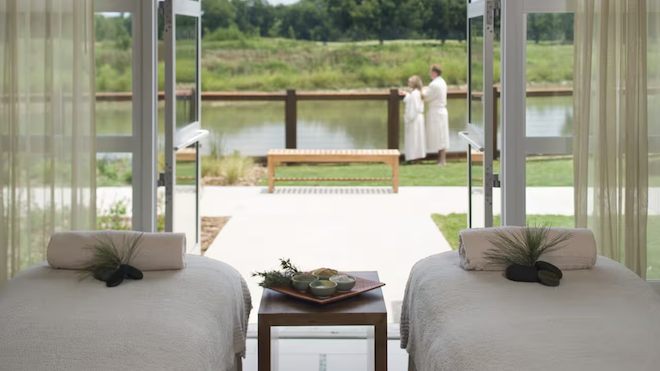 Two massage beds leading outside to a creek in Lost Pines, Texas. 