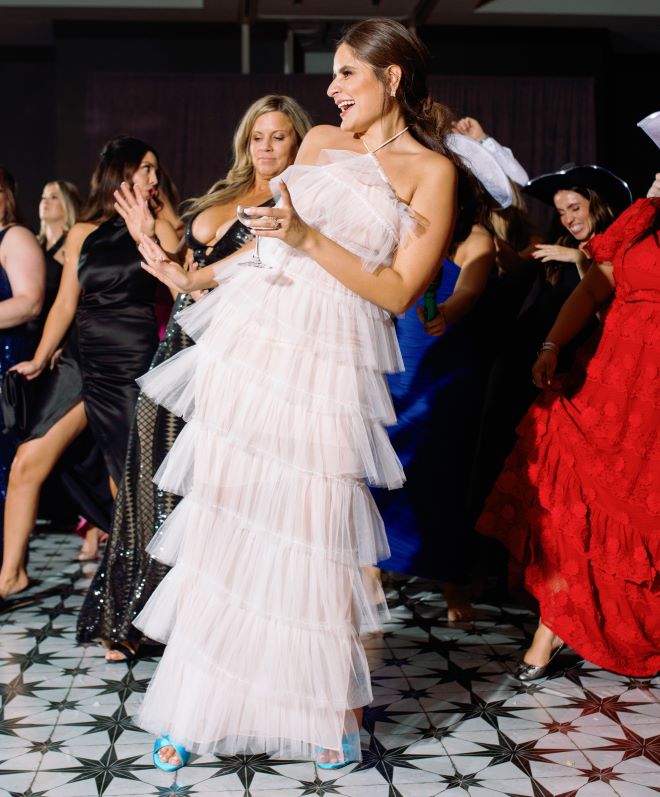 The bride dances in her after-party attire at her wedding reception in Houston. 