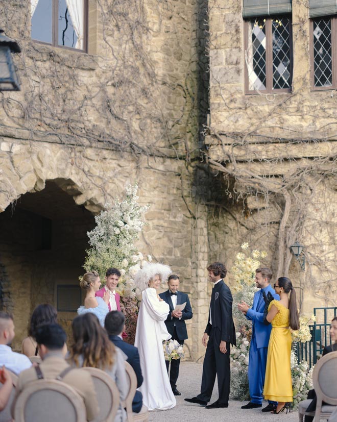 The bride and groom and their wedding party at the altar. 