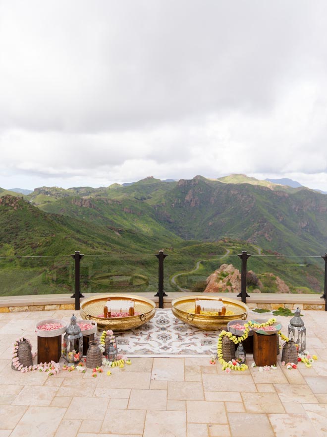 The bride and groom's haldi ceremony overlooks the mountains in Malibu.