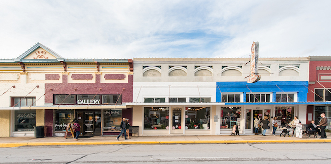 Pedestrians walk up and down the streets in Downtown Brenham.