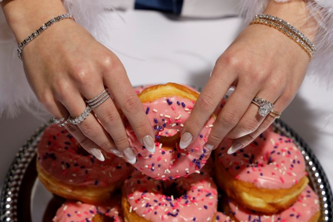 The model wears engagement rings available at Zadok Jewelers in Houston.