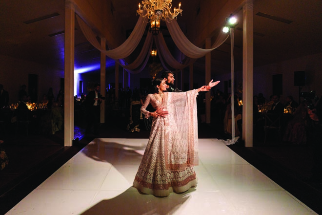 The bride and groom share a dance on the dance floor at their wedding reception.