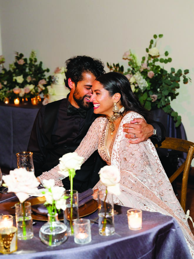 The bride and groom share an embrace at their wedding reception in Malibu.