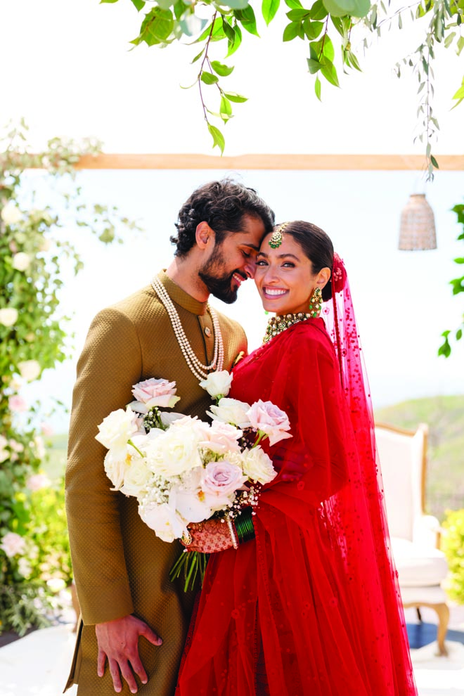 The bride and groom wed with a destination wedding in Malibu. 