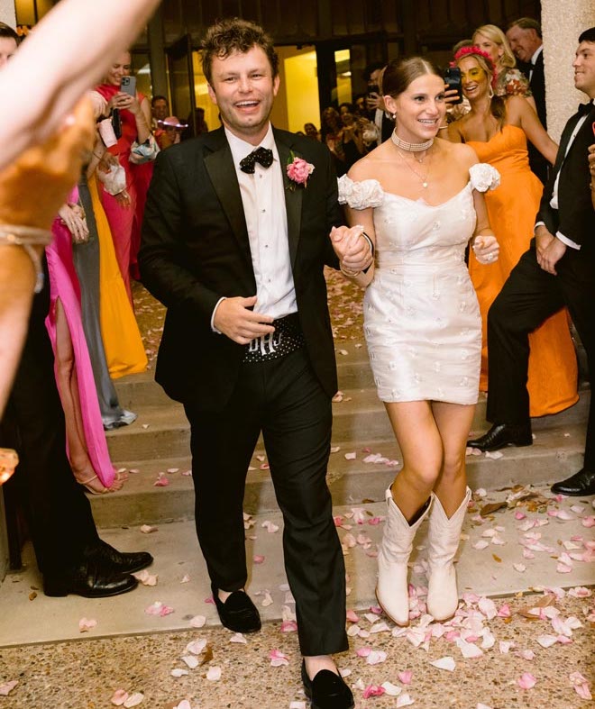 The bride and groom leaving the reception. 