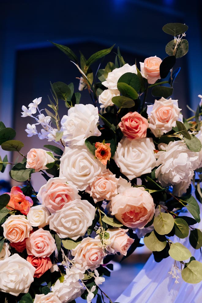 White and pink roses decorate the wedding ceremony in Houston. 