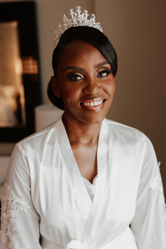 The bride wears a crown for intimate ballroom wedding captured by Nicole Johanna Photography.