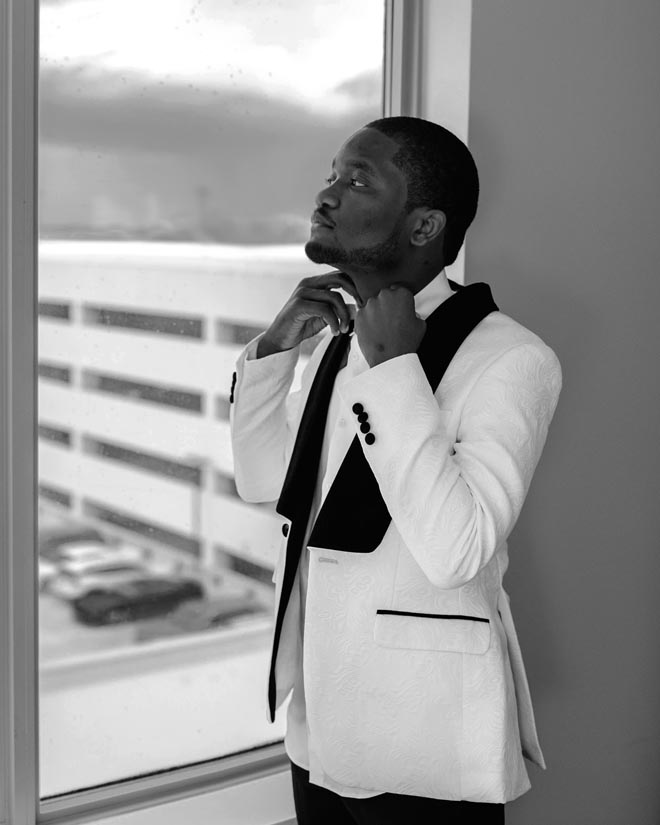 The groom gets ready for his intimate ballroom wedding in Houston.