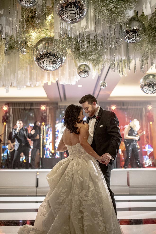 The bride and groom dance at their New Year's Eve wedding in Houston.