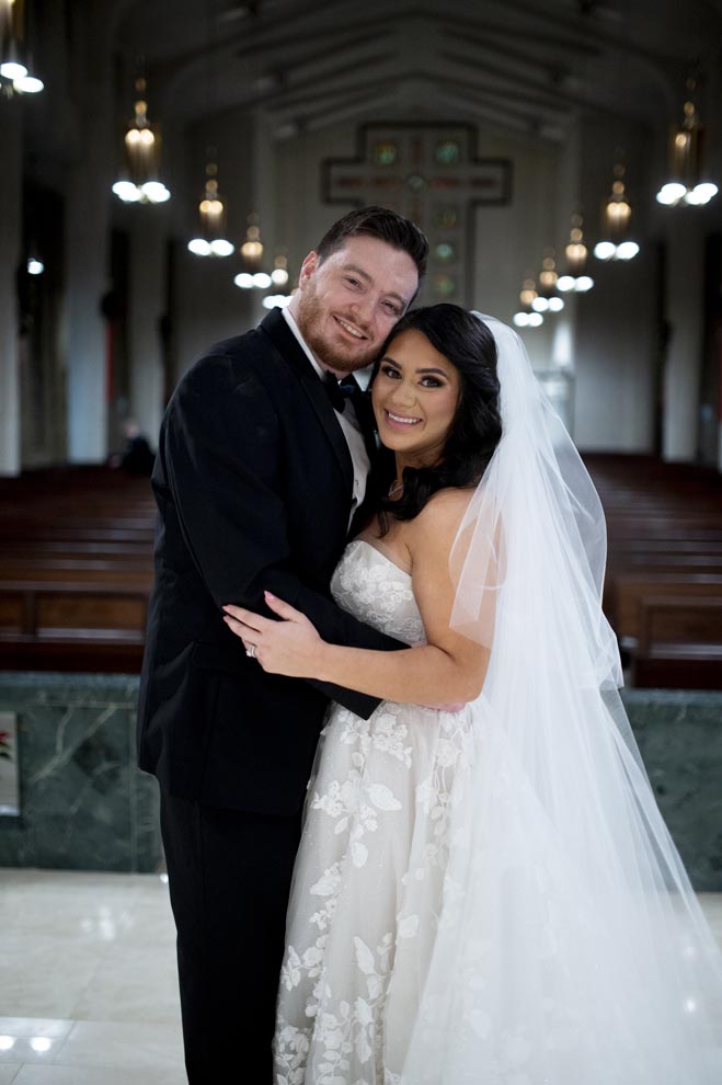 The bride and groom celebrate their marriage with a New Year's Eve wedding in Houston.