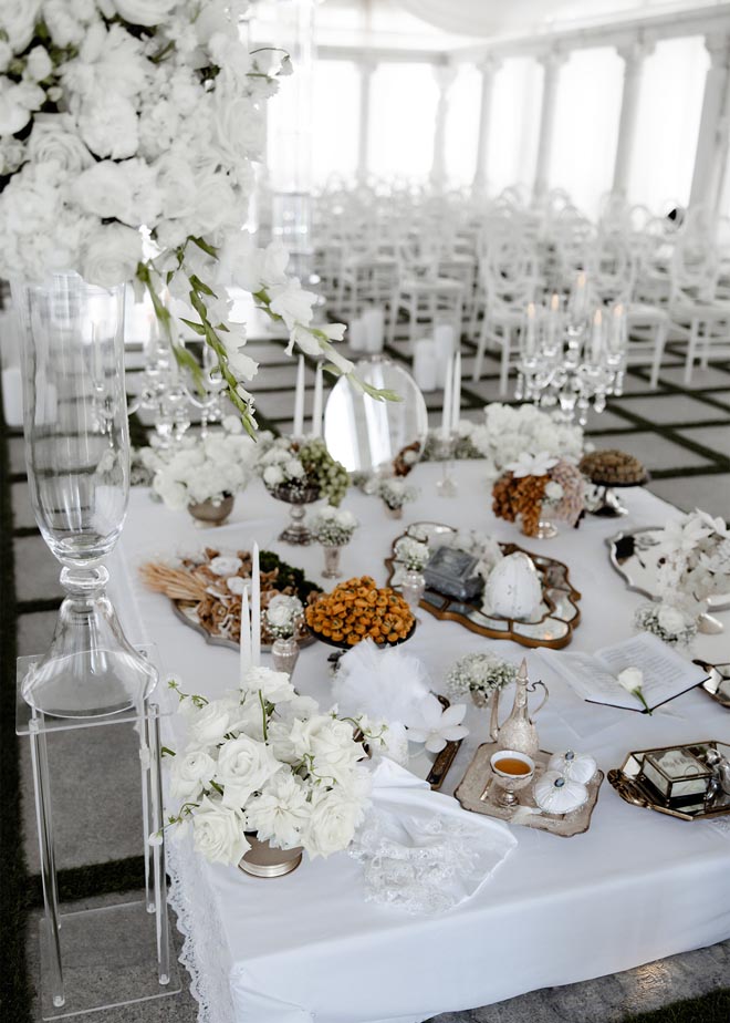 The Sofreh for the couple's Persian wedding ceremony is decorated in trinkets from Iran from the brides grandmother.