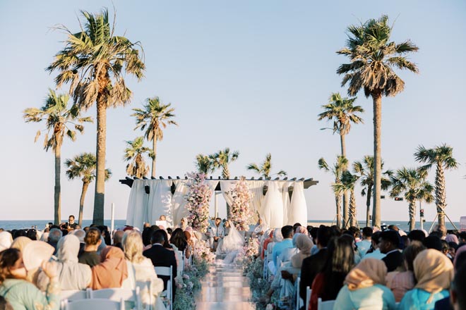 The bride and groom wed with an outdoor ceremony overlooking the Gulf Coast. 