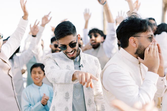 The groom and his friends celebrate before the pastel wedding at the Grand Galvez. 