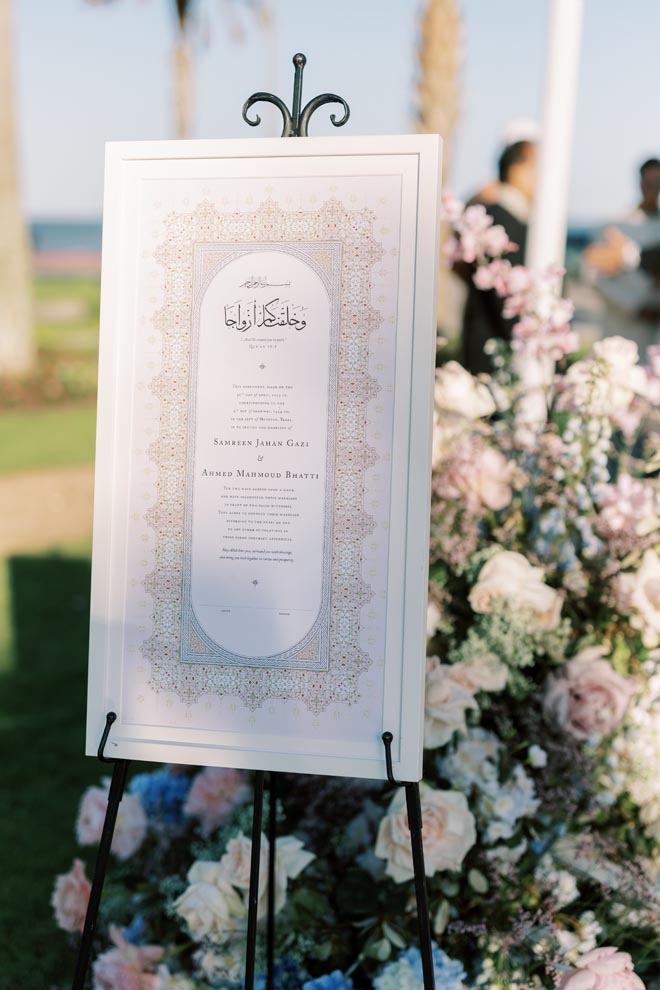 The bride and groom celebrate their nuptials with a pastel wedding on the Gulf Coast at the Grand Galvez. 