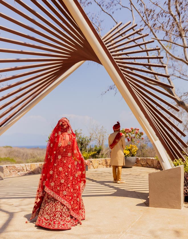 The bride walks up behind the groom for their first look. 