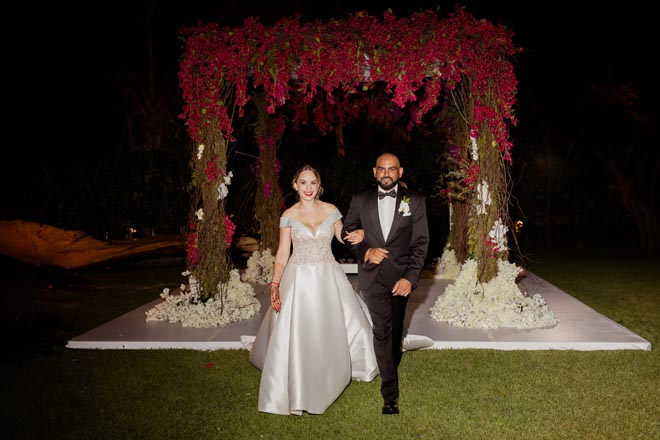 The couple walks around their destination wedding. 