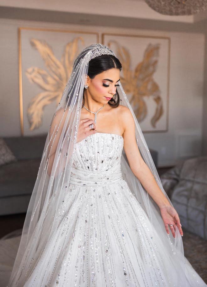 The bride models her wedding dress for her wedding ceremony in Houston.