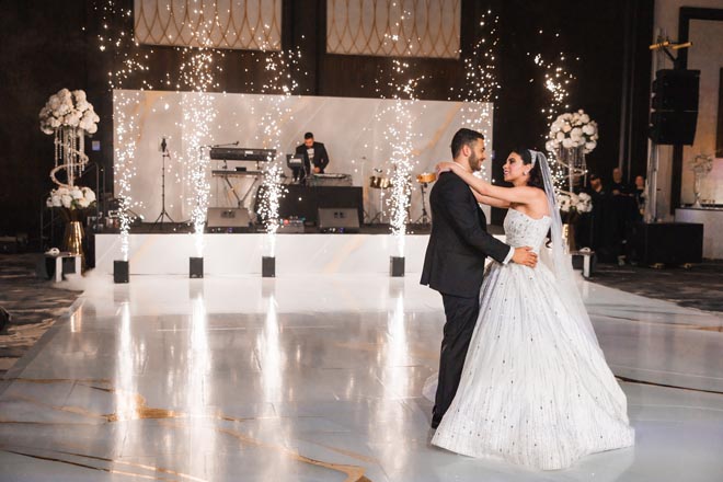 The bride and groom share a final dance in the ballroom at The Post Oak Hotel at Uptown Houston.