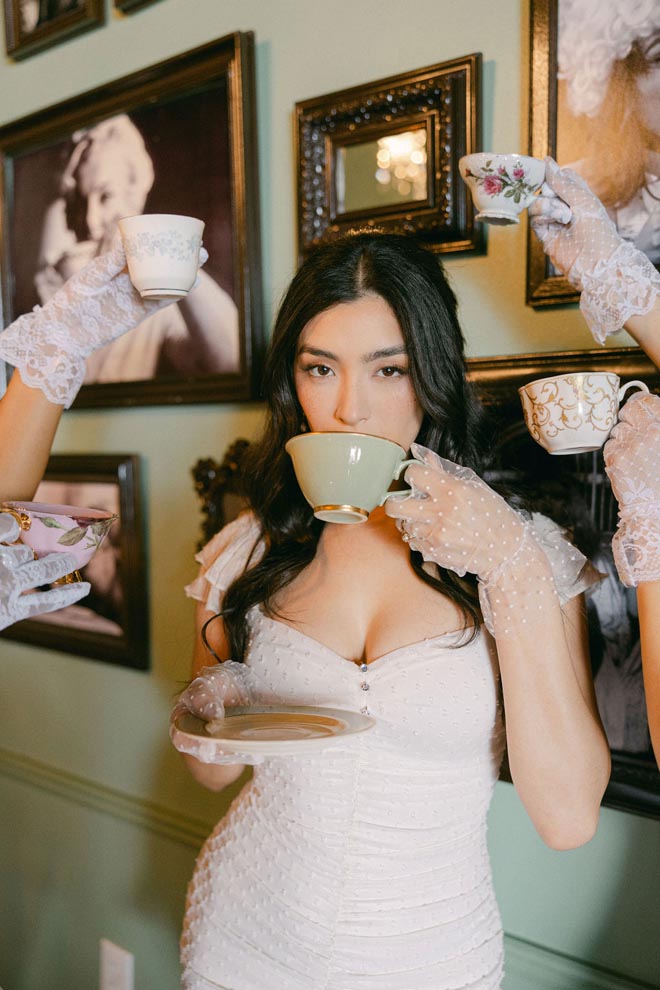 Vintage teacups surround the brides face at McHughTEA Room.