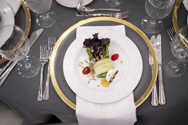 The Omni Houston Hotel caters the pink and navy ballroom wedding. 