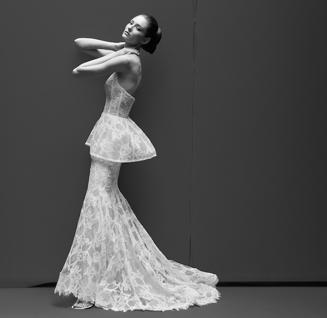 Model wearing an all-lace strapless peplum wedding gown. 