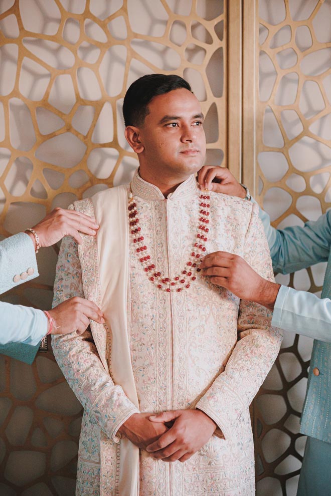 The groom gets ready for his traditional Hindu ceremony. 