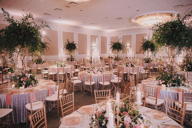 The bride and groom have a ballroom reception at The Westin Galleria Houston.