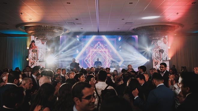 Wedding guests gather on the dance floor at The Westin Galleria Houston to celebrate the newlyweds.