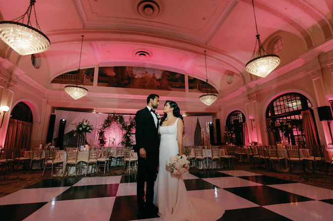 The bride and groom wed at the historic Houston wedding venue the Crystal Ballroom at The Rice.