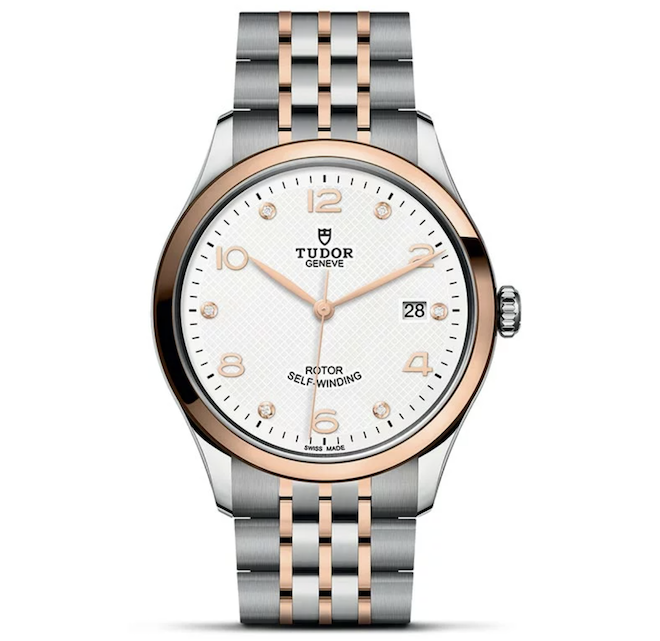 A silver and rose gold watch is a jewelry gift for the groom.